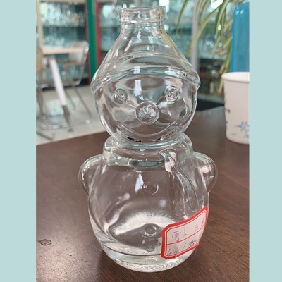 Durchsichtige Flachsglas-Schneemann-Form Whisky-Flasche mit Decal-Oberflächenbehandlung