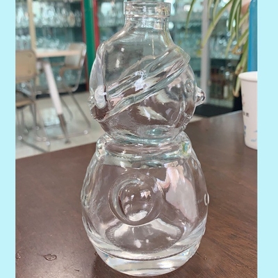Durchsichtige Flachsglas-Schneemann-Form Whisky-Flasche mit Decal-Oberflächenbehandlung